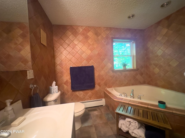 bathroom featuring a textured ceiling, a baseboard radiator, and a bathing tub