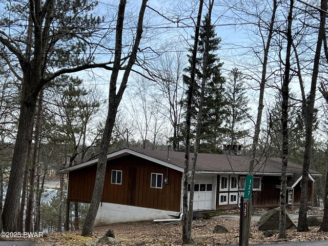 129 Waterview Dr, Lords Valley, PA 18428 - view of property exterior featuring an attached garage and board and batten siding