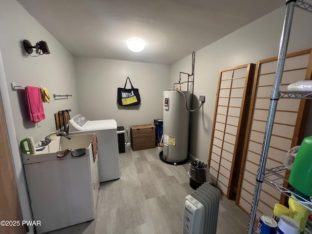 129 Waterview Dr, Lords Valley, PA 18428 - clothes washing area featuring laundry area, light wood finished floors, water heater, and washing machine and dryer