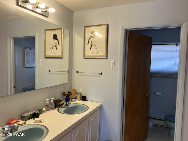 129 Waterview Dr, Lords Valley, PA 18428 - bathroom featuring baseboard heating, toilet, a sink, and double vanity