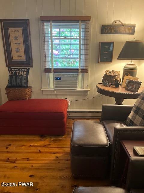 138 Lake Minisink Rd E, Dingmans Ferry, PA 18328 - living room with a baseboard heating unit, cooling unit, and wood finished floors