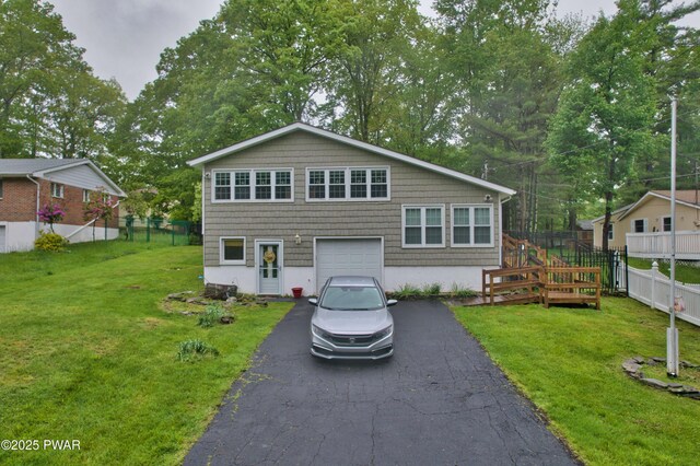 163 Wild Acres Dr, Dingmans Ferry, PA 18328 - rear view of property with driveway, an attached garage, and view of scattered trees