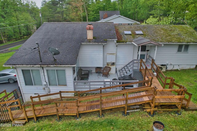 163 Wild Acres Dr, Dingmans Ferry, PA 18328 - rear view of house featuring a chimney, a deck, and roof with shingles