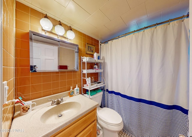 163 Wild Acres Dr, Dingmans Ferry, PA 18328 - full bathroom featuring tile walls, toilet, vanity, and a shower with curtain