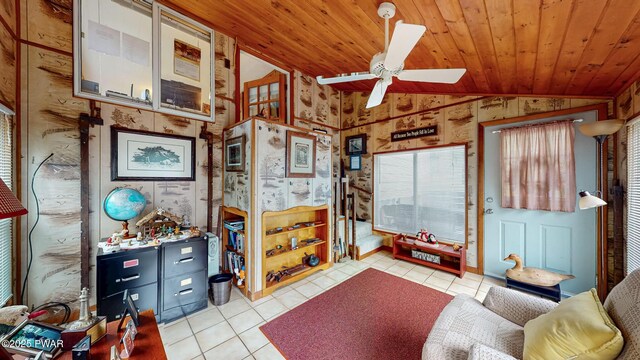 163 Wild Acres Dr, Dingmans Ferry, PA 18328 - living area with vaulted ceiling, tile patterned flooring, ceiling fan, wood ceiling, and wood walls