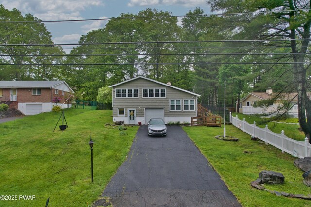 163 Wild Acres Dr, Dingmans Ferry, PA 18328 - view of front facade featuring driveway, a garage, and view of scattered trees