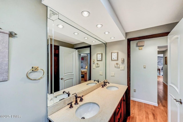 bathroom with vanity and hardwood / wood-style flooring