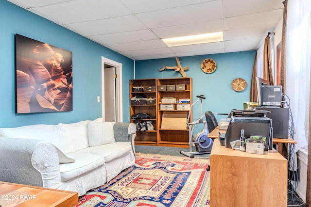 home office with a paneled ceiling