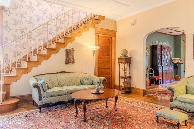 living room featuring hardwood / wood-style floors and ornamental molding