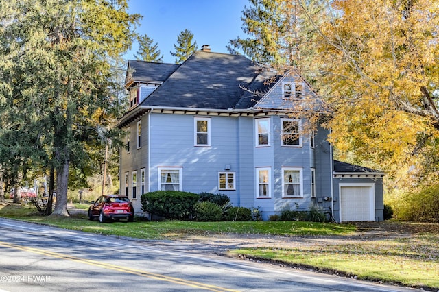 view of side of home featuring a garage