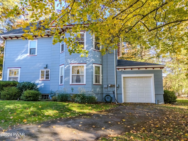 view of property exterior featuring a garage