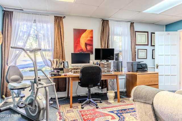 office area featuring a paneled ceiling