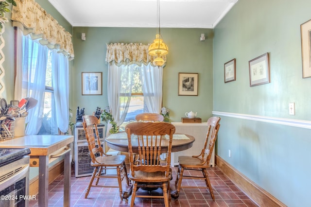 dining area featuring ornamental molding