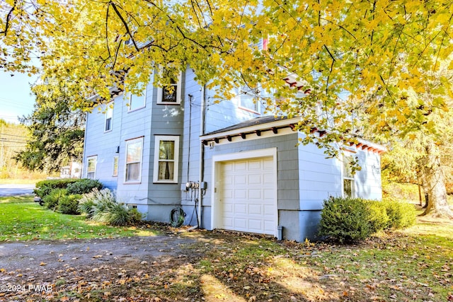 view of property exterior featuring a garage