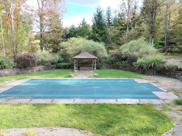 view of pool with a gazebo and a lawn