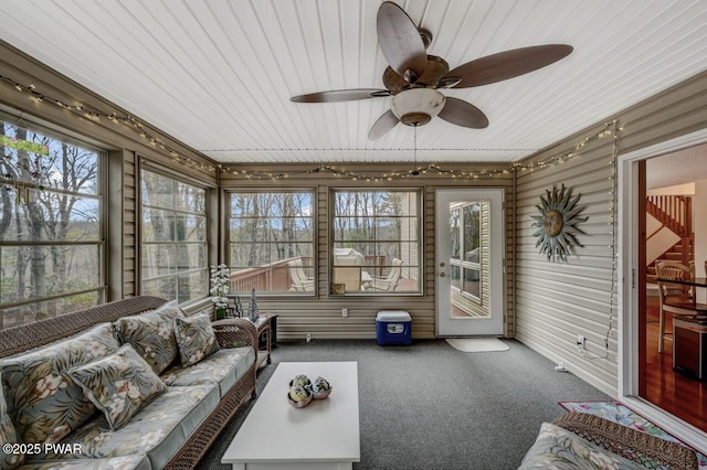 sunroom with a ceiling fan