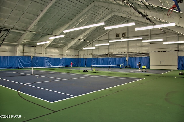 view of sport court featuring fence