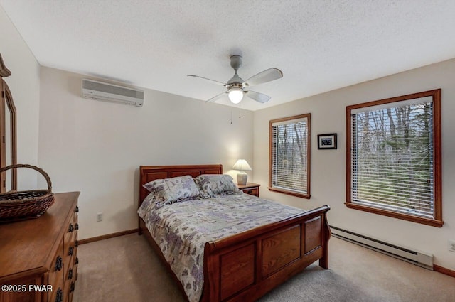 bedroom featuring an AC wall unit, multiple windows, baseboard heating, and light carpet