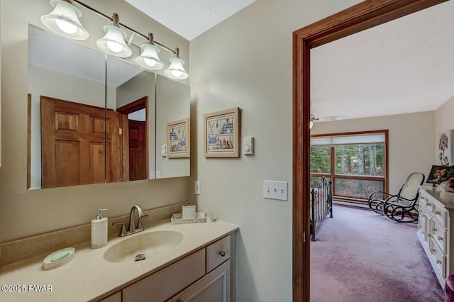 bathroom with a textured ceiling and vanity