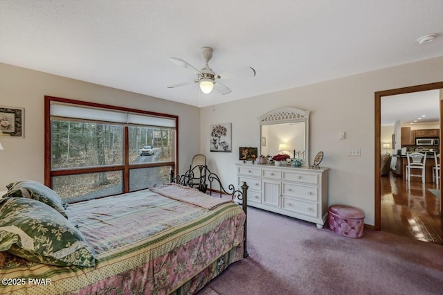 bedroom with carpet, baseboards, and ceiling fan