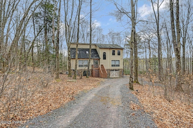 view of front of house with aphalt driveway and a garage