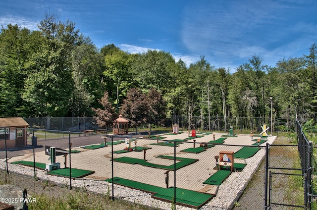 view of home's community featuring fence