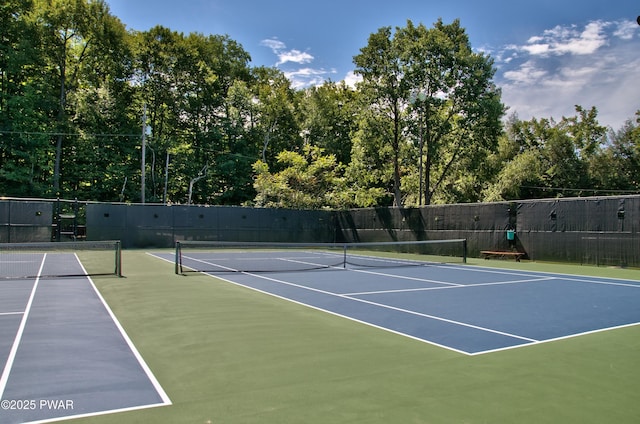 view of sport court featuring community basketball court and fence