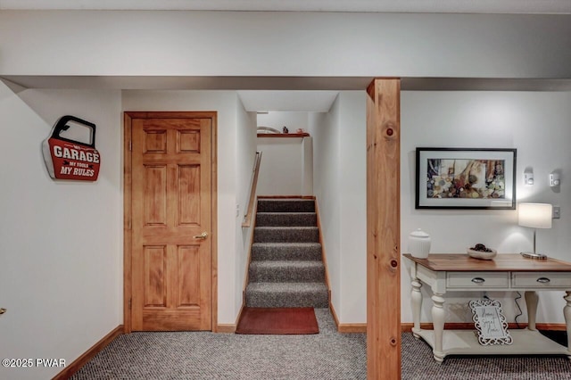 stairs featuring baseboards and carpet floors