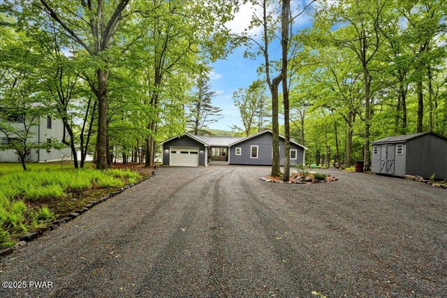 105 Cherry Point Ct, Hawley, PA 18428 - view of front of home featuring dirt driveway and an attached garage