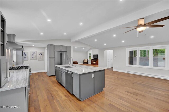 105 Cherry Point Ct, Hawley, PA 18428 - kitchen featuring gray cabinetry, stainless steel appliances, wall chimney exhaust hood, baseboard heating, and a sink