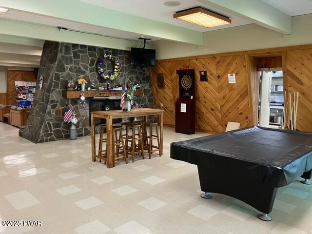 105 Cherry Point Ct, Hawley, PA 18428 - game room with billiards, tile patterned floors, beamed ceiling, and wood walls