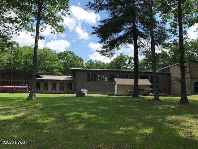 105 Cherry Point Ct, Hawley, PA 18428 - rear view of property featuring a yard and metal roof