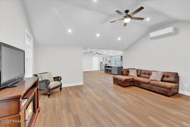 105 Cherry Point Ct, Hawley, PA 18428 - living area featuring ceiling fan, a wall mounted AC, lofted ceiling, light wood-style flooring, and baseboards
