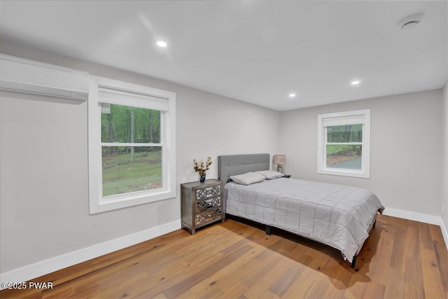 105 Cherry Point Ct, Hawley, PA 18428 - bedroom with baseboards, wood finished floors, multiple windows, and recessed lighting