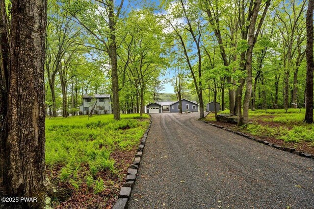 105 Cherry Point Ct, Hawley, PA 18428 - view of front of property with dirt driveway and a garage