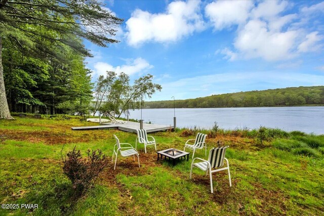 105 Cherry Point Ct, Hawley, PA 18428 - view of yard with a fire pit, a water view, and a view of trees
