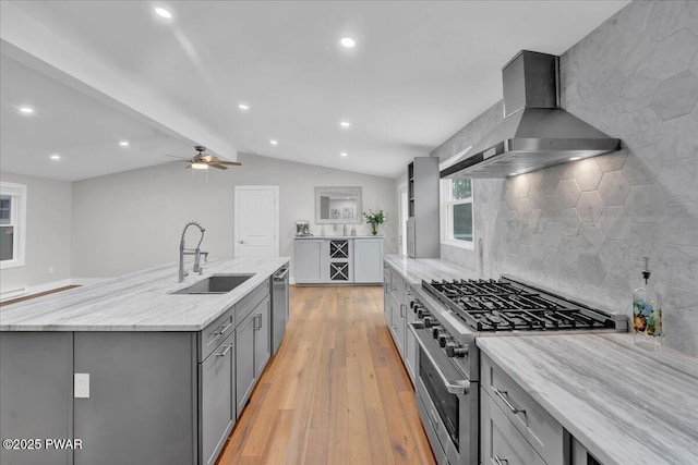 105 Cherry Point Ct, Hawley, PA 18428 - kitchen with wall chimney exhaust hood, a sink, gray cabinets, appliances with stainless steel finishes, and light wood-type flooring