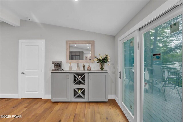 105 Cherry Point Ct, Hawley, PA 18428 - bar with lofted ceiling, light wood-type flooring, and baseboards