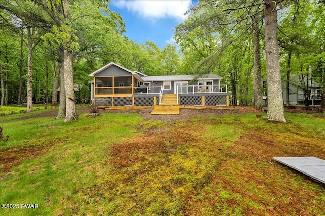 105 Cherry Point Ct, Hawley, PA 18428 - rear view of house featuring a sunroom and a wooden deck