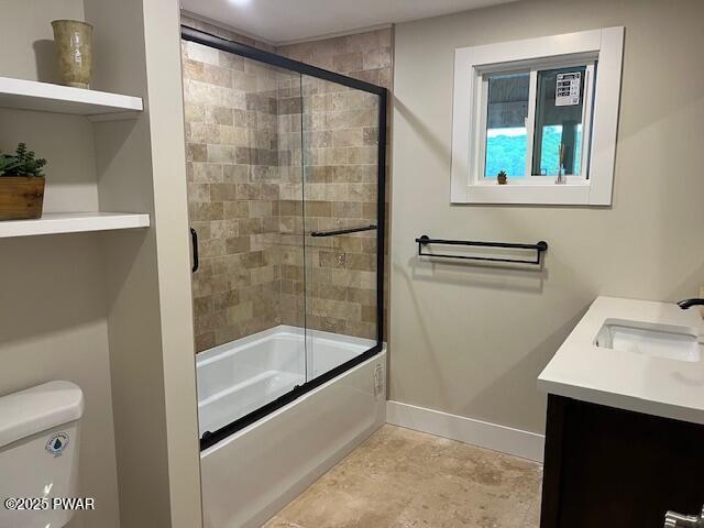 105 Cherry Point Ct, Hawley, PA 18428 - full bathroom featuring toilet, bath / shower combo with glass door, baseboards, and vanity