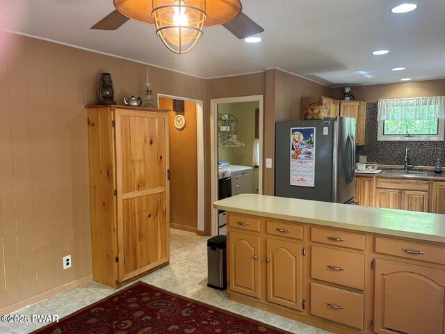106 Chestnut Dr, Greentown, PA 18426 - kitchen with freestanding refrigerator, a sink, separate washer and dryer, ceiling fan, and light flooring