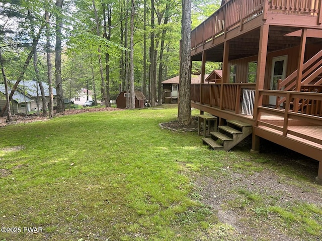 106 Chestnut Dr, Greentown, PA 18426 - view of grassy yard featuring a deck, a storage shed, and an outbuilding