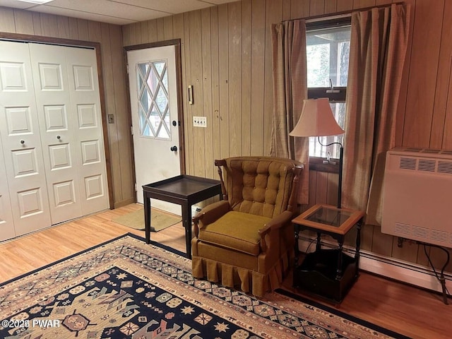 106 Chestnut Dr, Greentown, PA 18426 - entrance foyer with wood walls, light wood-type flooring, and heating unit