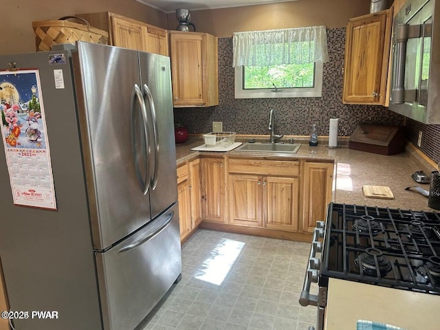 106 Chestnut Dr, Greentown, PA 18426 - kitchen with stainless steel appliances, a sink, and tasteful backsplash
