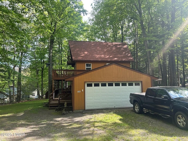 106 Chestnut Dr, Greentown, PA 18426 - view of side of property featuring a garage, stairway, and a deck