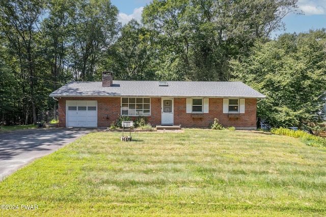 ranch-style house with a front lawn and a garage