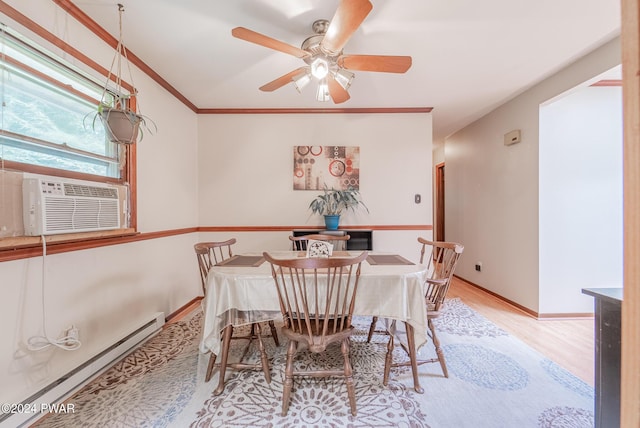 dining space featuring cooling unit, crown molding, light hardwood / wood-style flooring, ceiling fan, and baseboard heating