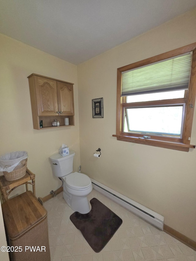 1304 Pratt Hollow Rd, Nicholson, PA 18446 - bathroom featuring a baseboard heating unit, baseboards, and toilet