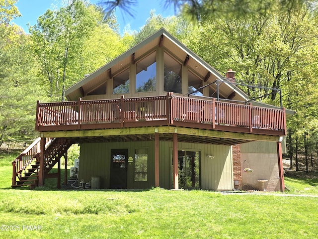 1304 Pratt Hollow Rd, Nicholson, PA 18446 - back of property featuring a wooden deck, a lawn, and stairs