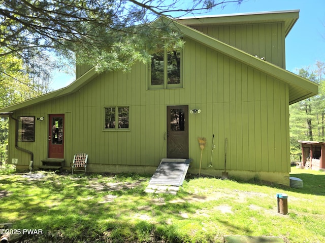 1304 Pratt Hollow Rd, Nicholson, PA 18446 - back of house featuring entry steps, a yard, and a chimney